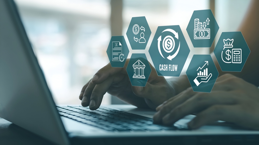 A,Business,Person,Using,Laptop,With,Cash,Flow,Statement,Concept